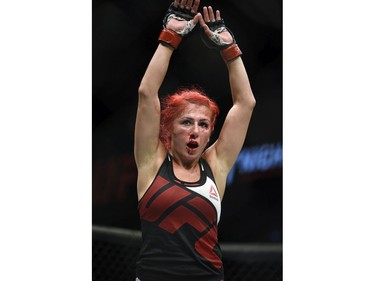 Windsor's Randa Markos, raisers her arms after fighting Jocelyn Jones-Lybarger in a prelim women's strawweight bout during UFC Fight Night: MacDonald vs. Thompson at TD Place Arena Saturday June 18, 2016. Markos won the decision.