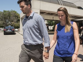 Kyla Cowan-Wilson leaves the Ottawa courthouse with her husband, Matthew Wilson, after she faced charges of sexual assault.