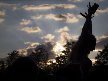 16 year old Hannah Blinn sitting on the shoulders of a friend during Schoolboy Q at Bluesfest Thursday July 7, 2016.