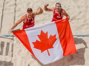 SOCHI, RUSSIA - JULY 10: Sam Pedlow (left) and Grant O'Gorman of Canada celebrate after winning the golden set and claiming ticket to Rio Olympics during FIVB World Continental Cup Olympic Qualification on July 10, 2016 in Sochi, Russia.  (Photo by Joosep Martinson/Getty Images)