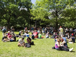 A couple hundred people gathered during a Pokémon Go Lure Party in Confederation Park Tuesday July 19, 2016.