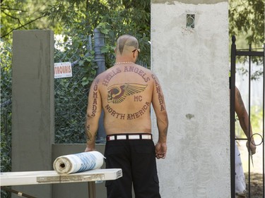 A Hells Angels Nomads member at the front gate of the group's compound in Carlsbad Springs.