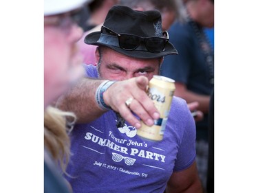 A man peeks through the crowd at the Bryan Ferry show.