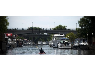 A paddler makes his way down the Rideau Canal on Canada Day, Friday July 1, 2016.