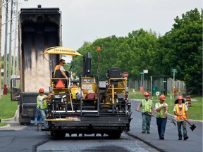 Workers from paving crews are subjected to extreme heat during hot weather.