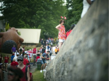 A woman stands outside the Bytown Museum on Canada Day in Ottawa, Friday, July 1, 2016.