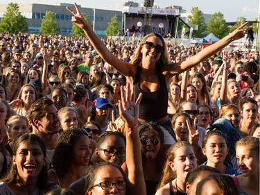 A young woman enjoying Alessia Cara performing on the City Stage.