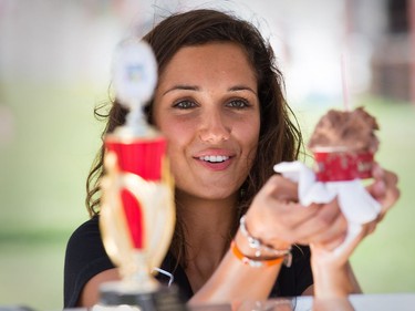 Arianna Meoni of Stella Luna serves up ice cream as the National Ice Cream Day is celebrated at the Ice Cream Festival taking place Sunday at the Canada Agriculture and Food Museum.