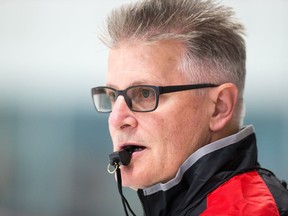 Assistant coach Marc Crawford watches the skaters as the Ottawa Senators hold their annual development camp at the Bell Sensplex. (WAYNE CUDDINGTON) Assignment - 124155