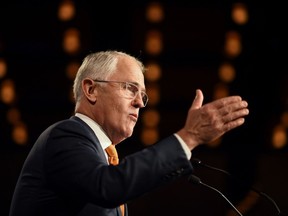 Australian Prime Minister Malcolm Turnbull speaks to the party faithful at a Liberal Party election night event in Sydney on July 3, 2016.  Australia's election was on a knife-edge with the ruling conservatives struggling to win enough seats to form majority government, raising the prospect of a hung parliament. /