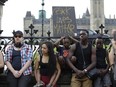 Black community members and activists rallied the public to take part in a peaceful demonstration in solidarity with the Black Lives Matter movement to bring attention to racial issues, in Ottawa on July 17, 2016. (Photo: David Kawai)