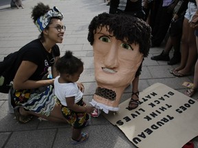 Black community members and activists rallied the public to take part in a peaceful demonstration in solidarity with the Black Lives Matter movement to bring attention to racial issues, in Ottawa on July 17, 2016. (Photo: David Kawai)