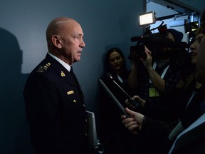 RCMP Commissioner Bob Paulson speaks to media after delivering a speech at a security conference in Ottawa on Nov. 25, 2015. Canada's top Mountie told the federal government last spring the RCMP had "moved beyond" internal issues of harassment and bullying through "concrete actions" that had fostered a more respectful workplace, newly disclosed records show. RCMP Commissioner Bob Paulson advised Steven Blaney, public safety minister at the time, that the problems had taken up a great deal of time and energy since he took the helm of the national police force three-and-a-half years earlier.