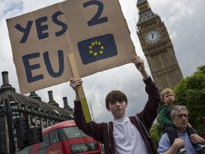 A small group of young people gathers to protest on Parliament Square the day after a majority of the British public voted for leaving the European Union on June 25, 2016 in London.