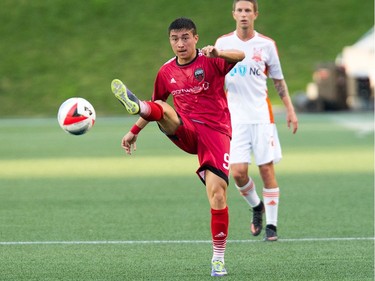 Bryan Olivera clears the ball in the first half.