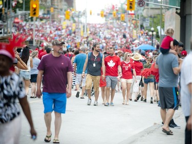 Canada Day revellers make their way up and down Rideau Street, Friday, July 1, 2016.