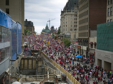 Canada Day revellers make their way up and down Rideau Street, Friday, July 1, 2016.