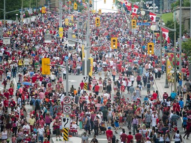 Canada Day revellers make their way up and down Rideau Street, Friday, July 1, 2016.