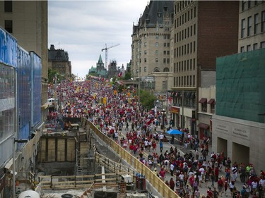 Day 24: Canada Day revellers make their way up and down Rideau Street where the sinkhole was downtown Ottawa Friday July 1, 2016.