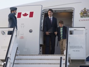 Canadian Prime Minister Justin Trudeau and his son Xavier disembark a government plane as they arrive in Warsaw, Poland, Friday July 8, 2016. THE CANADIAN PRESS/Adrian Wyld ORG XMIT: ajw102