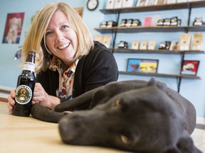 Chantal Mills, co-owner of Barking Barista Coffee Roasters, enjoys one their cold brews, Wet Kisses, with pooped pooch, Luna, at the Ottawa Canine School that Mills also runs.