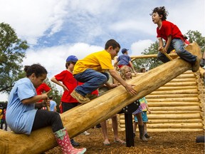Children play on the Quebec section of the Canada-themed park being constructed at Mooney's Bay Park.