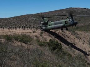CAMP PENDLETON, California (July 15, 2016) - Canadian Snipers, Pathfinders and Reconnaissance members, from 2nd Bataillon Royal 22nd Régiment, conduct insertion and extraction by helicopter training with a Royal Canadian Air Force CH-147F Chinook helicopter during Rim of the Pacific 2016 on Camp Pendleton in San Diego, California. Twenty-six nations, more than 40 ships and submarines, more than 200 aircraft and 25,000 personnel are participating in RIMPAC from June 30 to Aug. 4, in and around the Hawaiian Islands and Southern California. The world’s largest international maritime exercise, RIMPAC provides a unique training opportunity that helps participants foster and sustain the cooperative relationships that are critical to ensuring the safety of sea lanes and security on the world’s oceans. RIMPAC 2016 is the 25th exercise in the series that began in 1971. (Canadian Forces Combat Camera photo by Sgt Marc-André Gaudreault/Released)