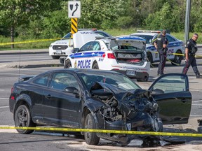 A collision between an Ottawa police cruiser and another vehicle has sent three people to hospital and closed a busy intersection in the city's south end Monday.