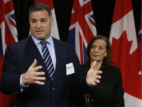 Former NHLer Eric Lindros appears at Queen's Park with Conservative MPP Lisa MacLeod in April to discuss Rowan's Law dealing with concussions.