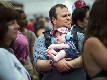 Dan Markel with his son, six-month-old Noah, in the crowd at The Paper Kites.