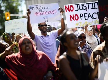 Demonstrators march from Somerset Square Park to Ottawa police headquarters on Elgin Street during the March for Justice - In Memory of Abdirahman Abdi. Saturday, July 30, 2016.