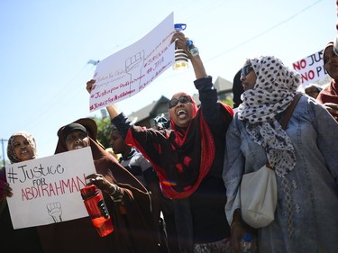 Demonstrators march from Somerset Square Park to Ottawa police headquarters on Elgin Street during the March for Justice - In Memory of Abdirahman Abdi. Saturday, July 30, 2016.