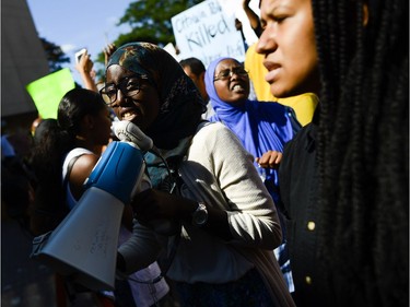 Demonstrators shout and chant for justice as they arrive at Ottawa police headquarters during the March for Justice - In Memory of Abdirahman Abdi. Saturday, July 30, 2016.