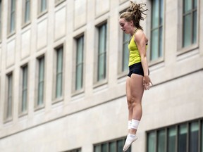 Emma Boswell catches some air during a trampoline show at the 25th Annual Ottawa International Buskerfest along Sparks St. in Ottawa.