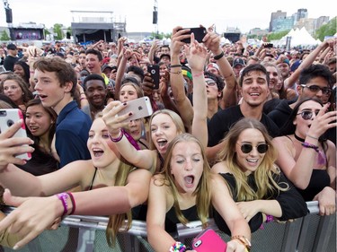 Excited fans of Belly as he performs on the City Stage at Ottawa Bluesfest on Sunday July 10, 2016.