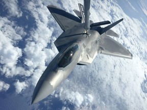 160726-N-PS287-001 JOINT BASE PEARL HARBOR-HICKAM (July 26, 2016) An F-22 Raptor from the 199th Fighter Squadron and the active-duty 19th Fighter Squadron receives fuel from a KC-135R Stratotanker belonging to the 465th Air Refueling Squadron from Tinker Air Force Base, Oklahoma, during Rim of the Pacific (RIMPAC) Exercise 2016. Twenty-six nations, 49 ships, six submarines, about 200 aircraft, and 25,000 personnel are participating in RIMPAC from June 29 to Aug. 4 in and around the Hawaiian Islands and Southern California. The world's largest international maritime exercise, RIMPAC provides a unique training opportunity while fostering and sustaining cooperative relationships between participants critical to ensuring the safety of sea lanes and security on the world's oceans. RIMPAC 2016 is the 25th exercise in the series that began in 1971. (U.S. Navy photo by LTJG Brendan McCabe/Released)