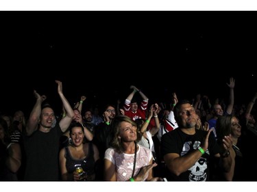 Fans enjoy Tragically Hip's Gord Downie, performs during the first stop of the Man Machine Poem Tour at the Save-On-Foods Memorial Centre in Victoria, B.C., Friday, July 22, 2016.