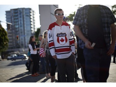 Fans gather to see Gord Downie, and the first stop of the Tragically Hip's Man Machine Poem Tour outside the Save-On-Foods Memorial Centre in Victoria, B.C., Friday, July 22, 2016.