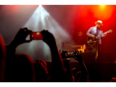 Fans take photos of Dallas Green of City and Colour on the City Stage.