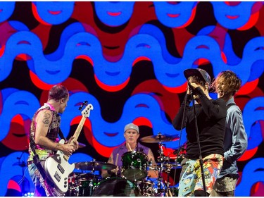 Flea, Chad Smith, Anthony Kiedis, and Josh Klinghoffer of the Red Hot Chili Peppers performing at Ottawa Bluesfest.