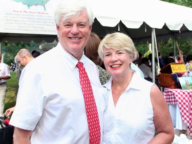 Former Liberal cabinet minister John Manley, now president and CEO of the Business Council of Canada, and his wife, Judith Manley, were among the thousands to attend the U.S. Embassy's 4th of July party, held Monday, July 4, 2016, in Rockcliffe Park, at the official residence of the U.S. ambassador.