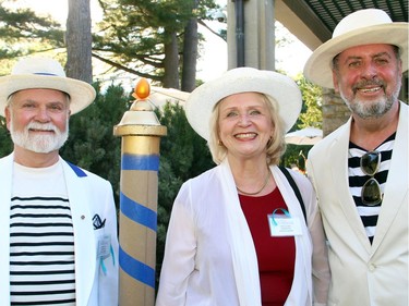 From left, Albert Benoit with fellow organizing committee members Nijole Kazlauskas-Deskin and Gerard Lavelle at the Venice-themed garden party held Tuesday, July 5, 2016, in Gatineau, at the official residence of the Italian ambassador, in support of Friends of the National Arts Centre Orchestra.