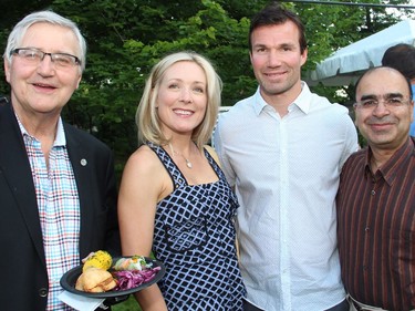 From left, George Weber, president and CEO of the Royal Ottawa Health Care Group, with Stephanie Richardson and Luke Richardson, who helped launch the DIFD (Do It For Daron) youth mental health awareness campaign, and Dr. Raj Bhatla, psychiatrist-in-chief and chief of staff of the Royal Ottawa, at the 4th of July party hosted by the U.S. Embassy at Lornado in Rockcliffe Park on Monday, July 4, 2016.