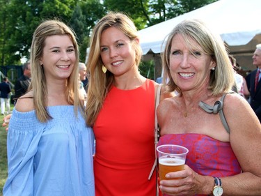 From left, Jamey Wieser, Sarah Turnbull and her mother, Celia Turnbull, were among the thousands of people to attend the 4th of July party, held Monday, July 4, 2016, in Rockcliffe Park at Lornado, the official residence of the U.S. ambassador.