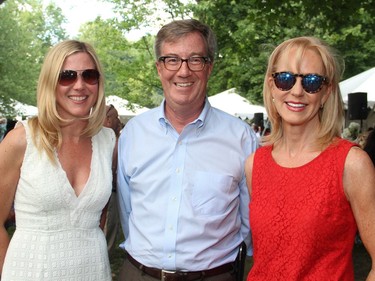 From left, Liza Mrak, Mark Motors of Ottawa, with Ottawa Mayor Jim Watson and Blair Dickerson at the 4th of July party hosted by the U.S. Embassy on Monday, July 4, 2016, in Rockcliffe Park, at the U.S. ambassador's official residence, Lornado.