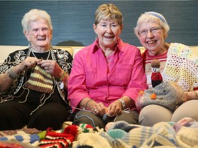From left: Monetta Ayotte, Jayne Spence and June Warner are just three of a dozen ladies who form the Knotty Knitters Group in Stittsville.