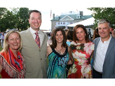 From left, Velma McColl, Earnscliffe Strategy Group, with popular restaurateur Stephen Beckta and his wife, Maureen Cunningham, and Joanne York and her husband, Farm Boy chief executive Jeff York, at the U.S. Embassy's 4th of July party, held Monday, July 4, 2016, at Lornado, the official residence of the U.S. ambassador and his wife.