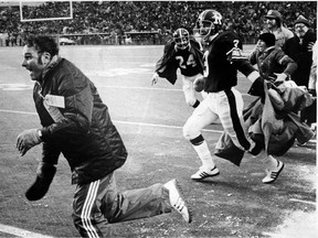 Head coach George Brancato and members of the Ottawa Rough Riders celebrate their 23-20 victory over the Saskatchewan Rough Riders in the 1976 Grey Cup game.