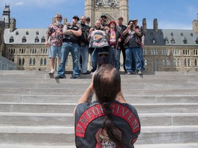 Hells Angels from Alberta pause for a photo on Parliament Hill July 23, 2016.