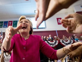 Democratic presidential candidate Hillary Clinton greets supporters as she arrives for a rally at McGonigle Hall at Temple University in Philadelphia Friday.